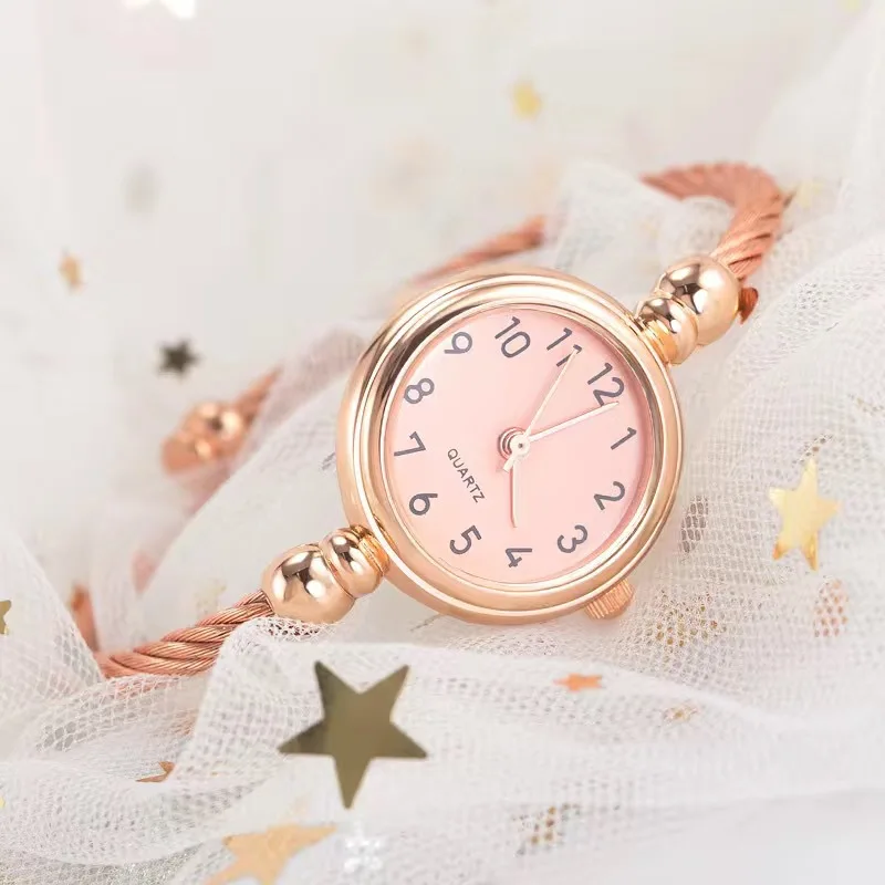 A Watch On A White Mesh