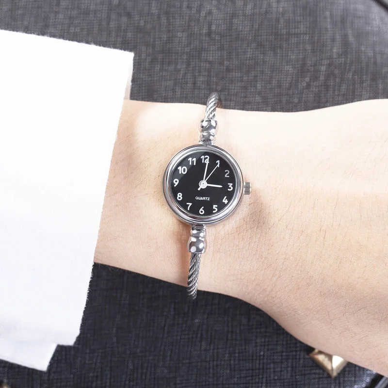 A Wrist With A Watch On It