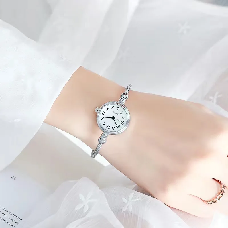 A Woman Wearing A Watch