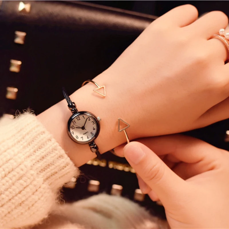 A Person Wearing A Watch And Bracelets