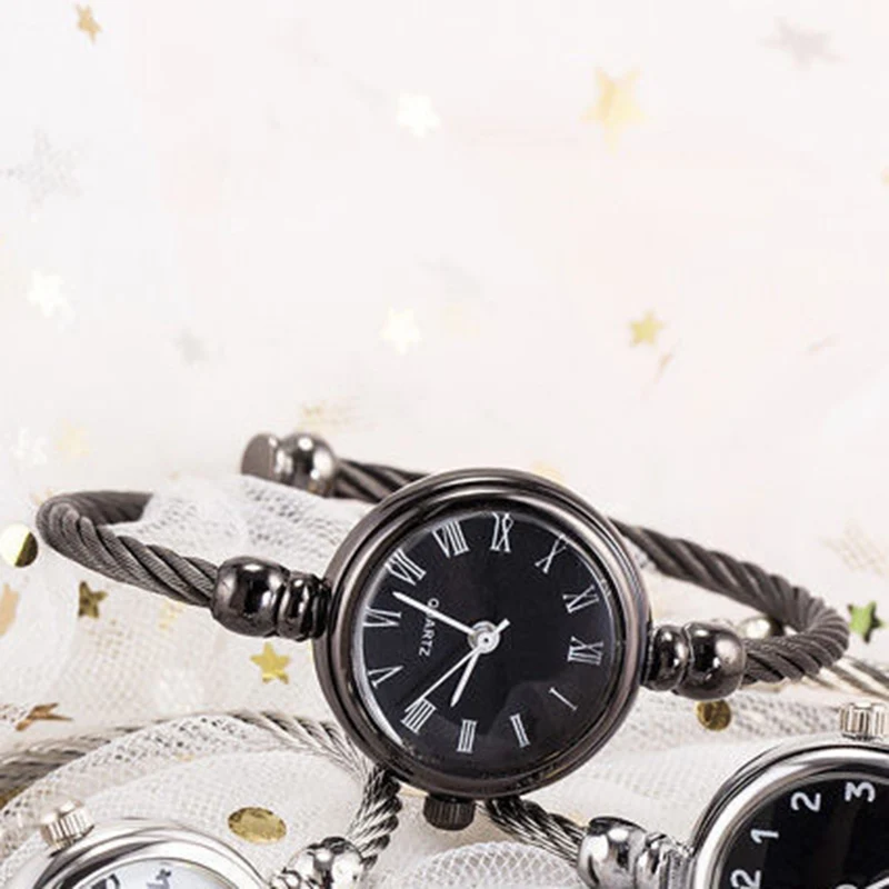 A Group Of Watches On A White Fabric
